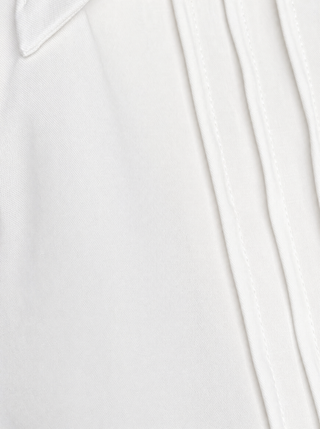 Close-up of a white popline cotton fabric with a subtle pattern