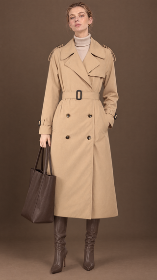 Margaux trench coat in sand beige, styled with brown leather tote and boots