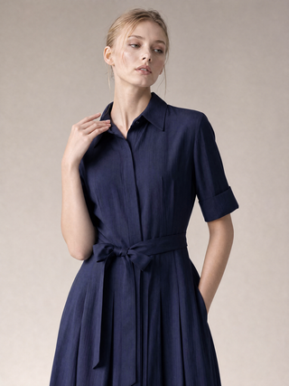Simone shirt-dress walking view, pleated skirt movement in midnight navy