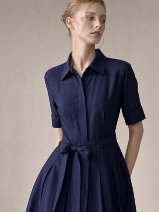 Simone shirt-dress in motion, pleated midi skirt and concealed button front
