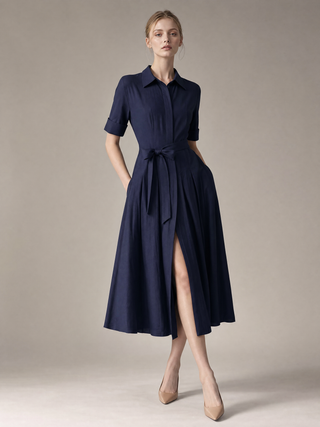 Simone shirt-dress campaign image, midnight navy cotton-silk in late afternoon light