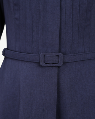 Close-up of the covered buckle on the Mathilde self-fabric belt in midnight navy wool-blend twill