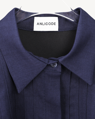 Inside neck of the Mathilde midnight navy shirt-dress: collar stand, top button and ANLICODE label